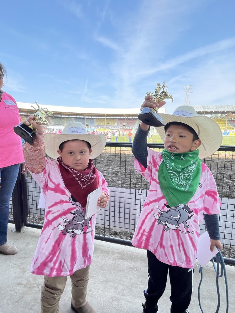 two boys with trophies