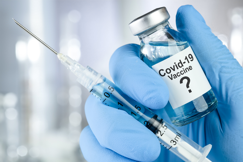 covid vaccine bottle and syringe